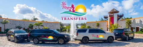 Four Isla Mujeres Transfers SUVs in front of a fountain and stone buildings